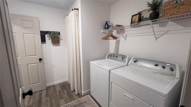 10123 Carp Hollow Rd, Sun City Center, FL 33573 - washroom featuring independent washer and dryer, dark wood-style floors, and baseboards