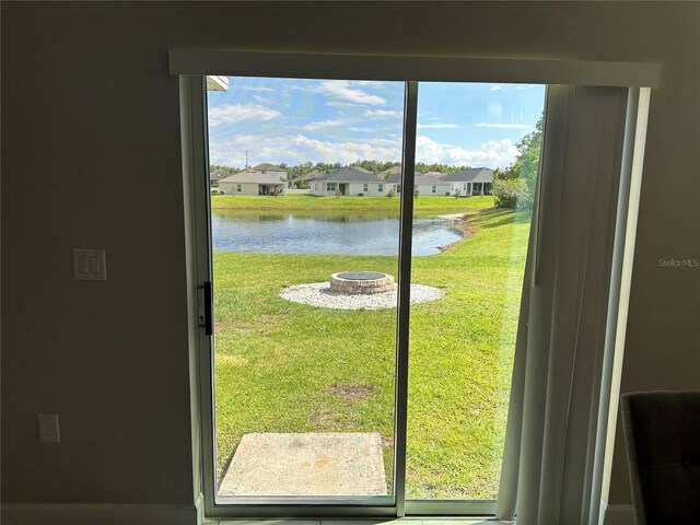 1509 Venice Ln, Davenport, FL 33896 - doorway featuring a water view, a residential view, and plenty of natural light