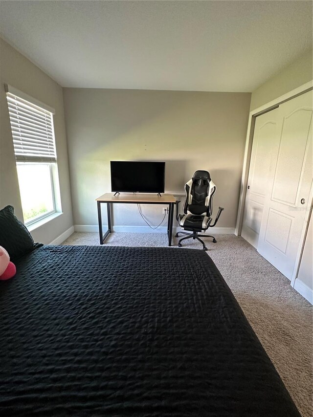 1509 Venice Ln, Davenport, FL 33896 - carpeted bedroom featuring baseboards