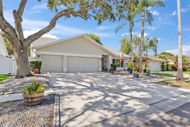 11927 Steppingstone Blvd, Tampa, FL 33635 - ranch-style house featuring a garage and concrete driveway