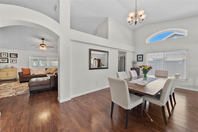 11927 Steppingstone Blvd, Tampa, FL 33635 - dining area featuring a chandelier, dark wood-style flooring, baseboards, a ceiling fan, and high vaulted ceiling