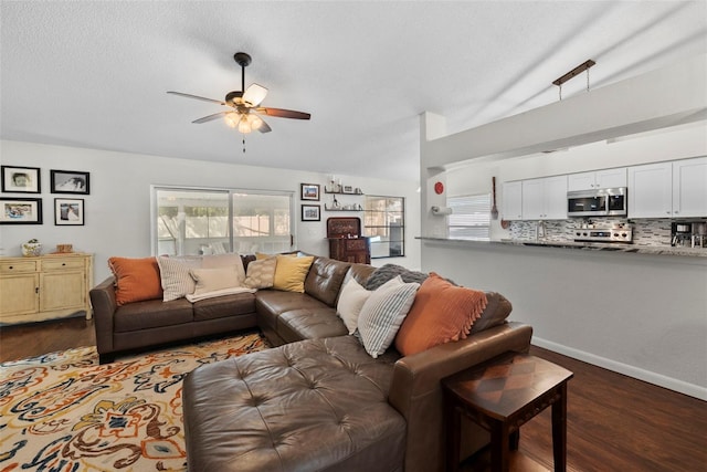 11927 Steppingstone Blvd, Tampa, FL 33635 - living area with a ceiling fan, dark wood-style flooring, and lofted ceiling
