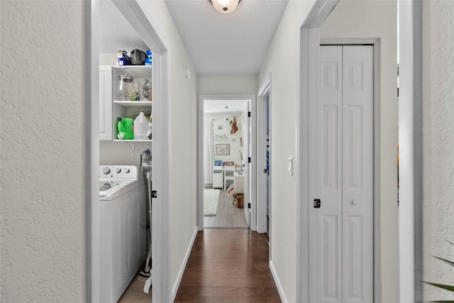 11927 Steppingstone Blvd, Tampa, FL 33635 - hallway with washer / clothes dryer, dark wood-type flooring, a textured wall, a textured ceiling, and baseboards