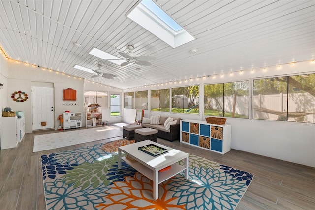 11927 Steppingstone Blvd, Tampa, FL 33635 - sunroom / solarium with a skylight, an outdoor living space with a fire pit, plenty of natural light, vaulted ceiling, and ceiling fan
