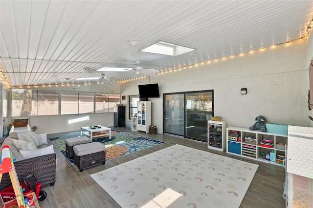11927 Steppingstone Blvd, Tampa, FL 33635 - interior space with wood finished floors, a skylight, and ceiling fan