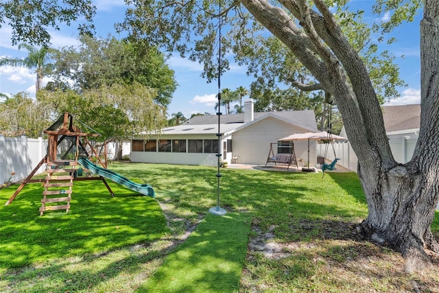11927 Steppingstone Blvd, Tampa, FL 33635 - rear view of house with a sunroom and a playground