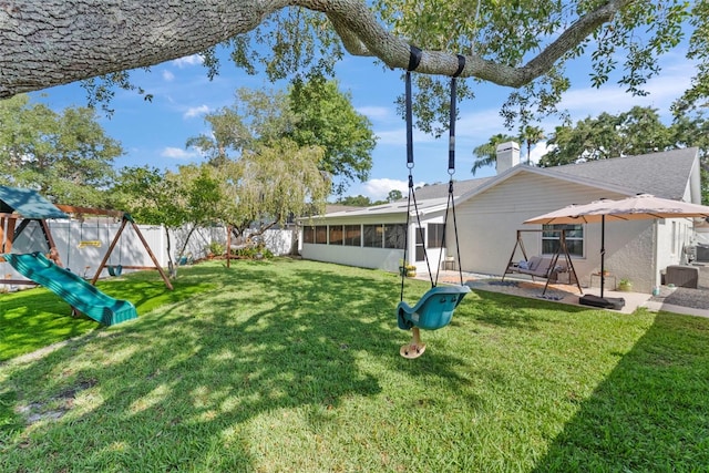 11927 Steppingstone Blvd, Tampa, FL 33635 - view of yard featuring a sunroom, a playground, and a patio