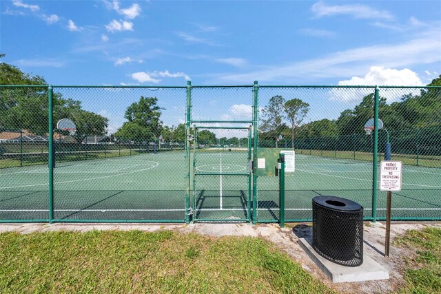 11927 Steppingstone Blvd, Tampa, FL 33635 - view of tennis court featuring a gate and community basketball court