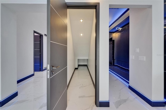 6530 Simone Shores Cir, Apollo Beach, FL 33572 - corridor featuring marble tiled floors and baseboards