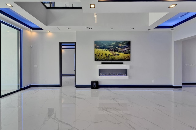 6530 Simone Shores Cir, Apollo Beach, FL 33572 - spare room featuring marble tiled floors, baseboards, a tray ceiling, and recessed lighting