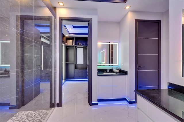 6530 Simone Shores Cir, Apollo Beach, FL 33572 - full bathroom with marble tiled floors, vanity, a stall shower, and recessed lighting