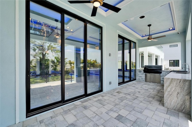 6530 Simone Shores Cir, Apollo Beach, FL 33572 - view of patio featuring a ceiling fan, exterior kitchen, and a sink