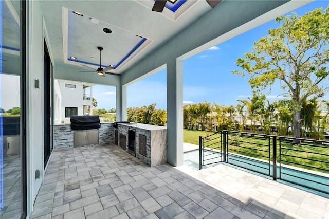 6530 Simone Shores Cir, Apollo Beach, FL 33572 - view of patio / terrace with a ceiling fan and exterior kitchen