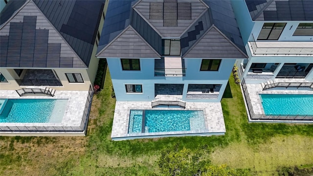 6530 Simone Shores Cir, Apollo Beach, FL 33572 - back of property featuring a patio area and an outdoor pool