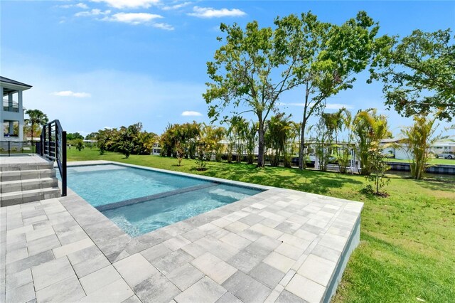 6530 Simone Shores Cir, Apollo Beach, FL 33572 - view of swimming pool featuring a yard, a patio area, and a pool with connected hot tub