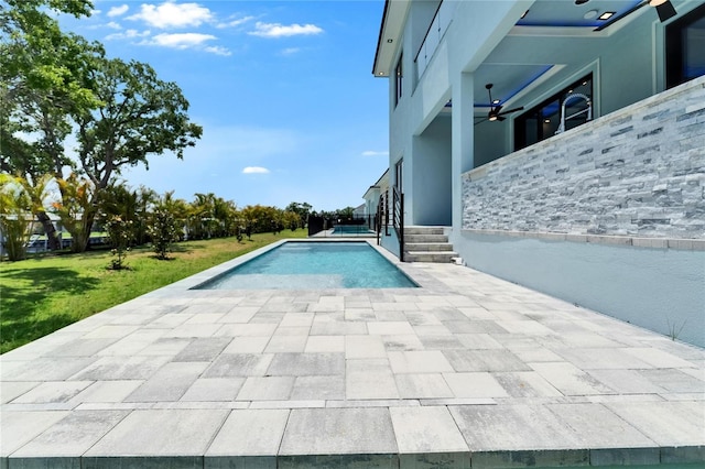 6530 Simone Shores Cir, Apollo Beach, FL 33572 - outdoor pool with a lawn, a patio, and a ceiling fan