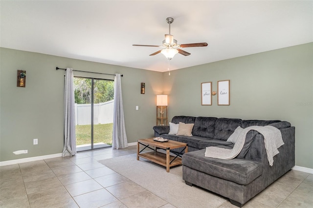 10104 Carloway Hills Dr, Wimauma, FL 33598 - living area with a ceiling fan, baseboards, and light tile patterned floors