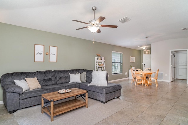 10104 Carloway Hills Dr, Wimauma, FL 33598 - living room with ceiling fan, baseboards, and light tile patterned floors