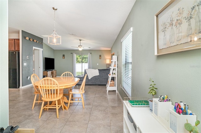10104 Carloway Hills Dr, Wimauma, FL 33598 - dining area with a ceiling fan, light tile patterned floors, and baseboards