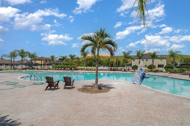 10104 Carloway Hills Dr, Wimauma, FL 33598 - community pool featuring a patio area