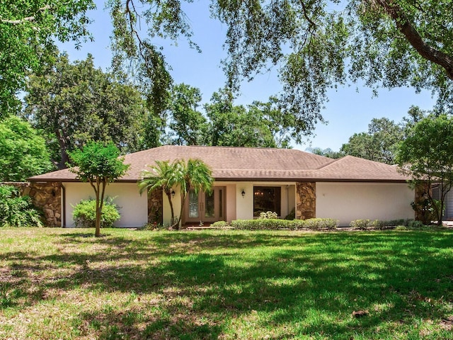 2217 High Point Dr, Brandon, FL 33511 - ranch-style house featuring a front yard, stone siding, and stucco siding