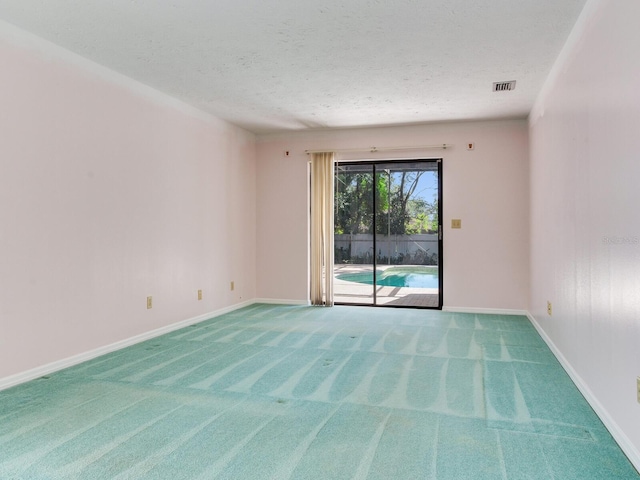 2217 High Point Dr, Brandon, FL 33511 - carpeted empty room with a textured ceiling and baseboards