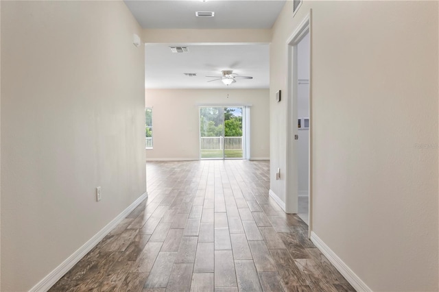 12170 Gothic Rd, Spring Hill, FL 34610 - hall featuring wood finished floors and baseboards