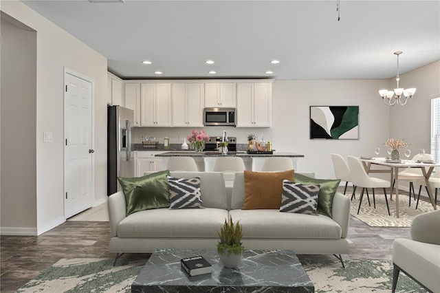 12170 Gothic Rd, Spring Hill, FL 34610 - living area with a chandelier, recessed lighting, baseboards, and wood finished floors
