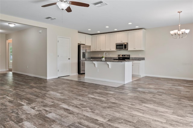 12170 Gothic Rd, Spring Hill, FL 34610 - kitchen featuring stainless steel appliances, open floor plan, a ceiling fan, baseboards, and recessed lighting