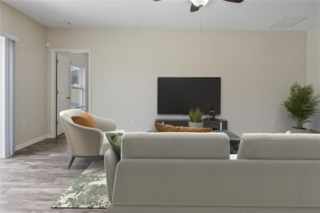 12170 Gothic Rd, Spring Hill, FL 34610 - living area with wood finished floors, ceiling fan, and baseboards