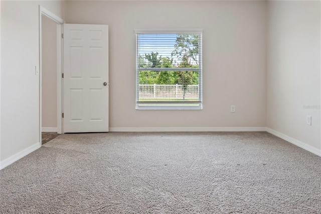 12170 Gothic Rd, Spring Hill, FL 34610 - carpeted spare room with baseboards