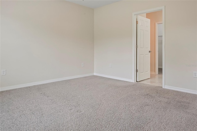 12170 Gothic Rd, Spring Hill, FL 34610 - empty room with light colored carpet and baseboards