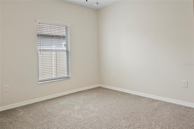 12170 Gothic Rd, Spring Hill, FL 34610 - carpeted spare room featuring plenty of natural light and baseboards