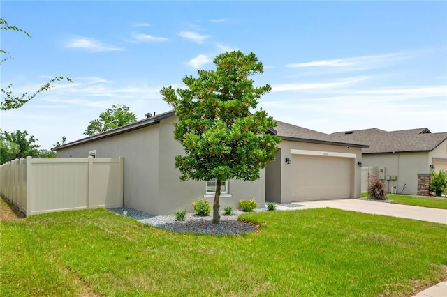 12170 Gothic Rd, Spring Hill, FL 34610 - view of front facade featuring a garage, driveway, and stucco siding