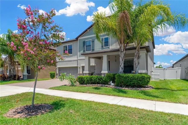 11612 Sunburst Marble Rd, Riverview, FL 33579 - view of front of property with an attached garage, driveway, stucco siding, and a porch