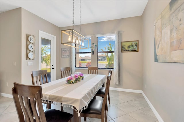11612 Sunburst Marble Rd, Riverview, FL 33579 - dining space with a chandelier, light tile patterned floors, and healthy amount of natural light