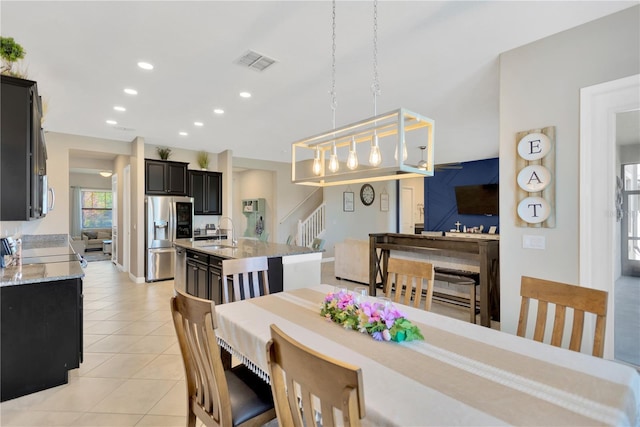 11612 Sunburst Marble Rd, Riverview, FL 33579 - dining room featuring stairs, light tile patterned flooring, and recessed lighting