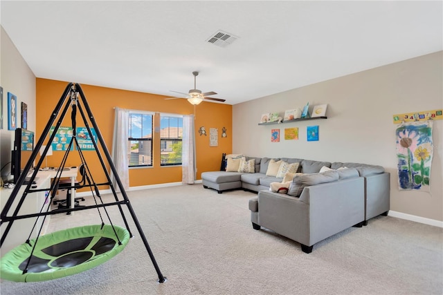 11612 Sunburst Marble Rd, Riverview, FL 33579 - living room with ceiling fan, baseboards, and light colored carpet