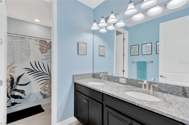 11612 Sunburst Marble Rd, Riverview, FL 33579 - full bathroom featuring double vanity, tile patterned floors, and a shower with shower curtain
