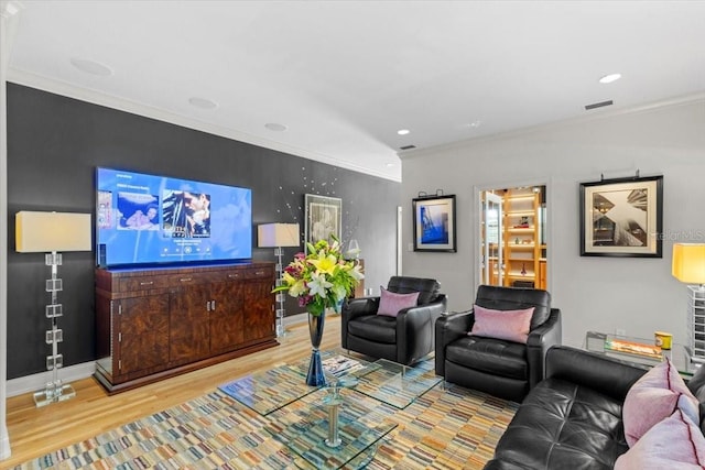 213 N Hesperides St, Tampa, FL 33609 - living area with wood finished floors, baseboards, crown molding, and recessed lighting