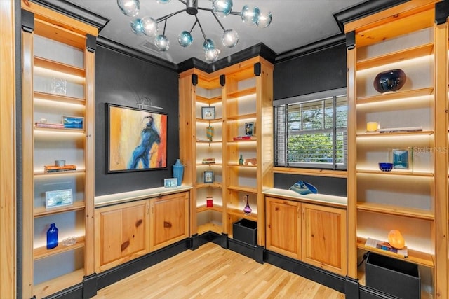 213 N Hesperides St, Tampa, FL 33609 - interior space featuring wood finished floors and a chandelier