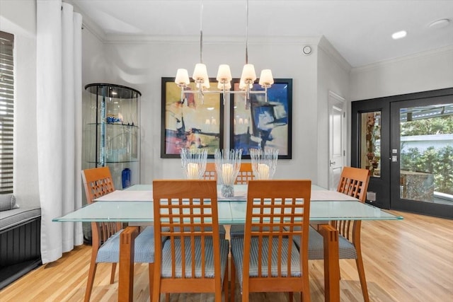 213 N Hesperides St, Tampa, FL 33609 - dining room with wood finished floors, ornamental molding, and a chandelier