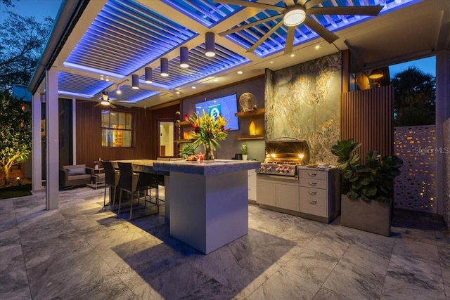 213 N Hesperides St, Tampa, FL 33609 - view of patio with area for grilling, ceiling fan, and exterior bar