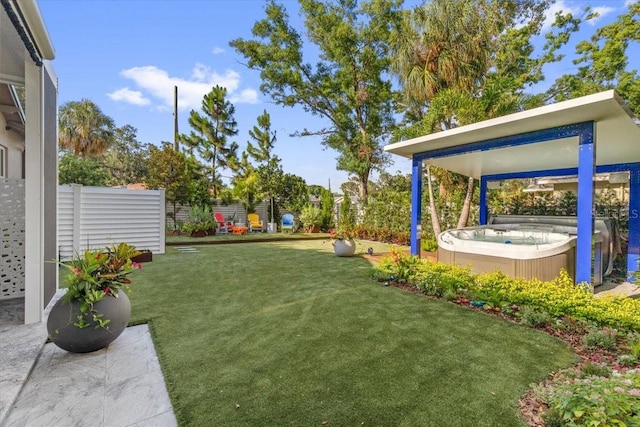 213 N Hesperides St, Tampa, FL 33609 - view of grassy yard with a hot tub