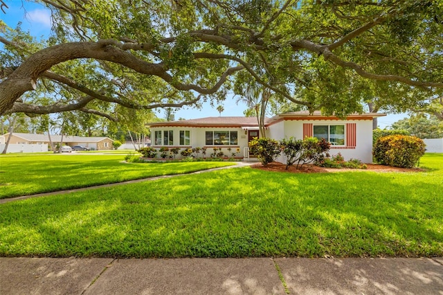 5800 3rd St S, Saint Petersburg, FL 33705 - single story home with a front lawn and stucco siding