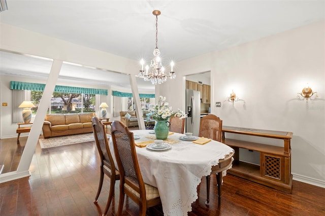 5800 3rd St S, Saint Petersburg, FL 33705 - dining area with a chandelier and dark wood-type flooring