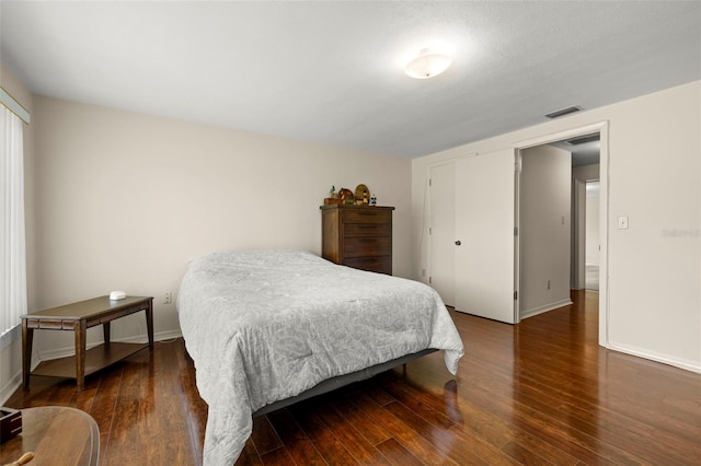 5800 3rd St S, Saint Petersburg, FL 33705 - bedroom featuring wood finished floors and a closet