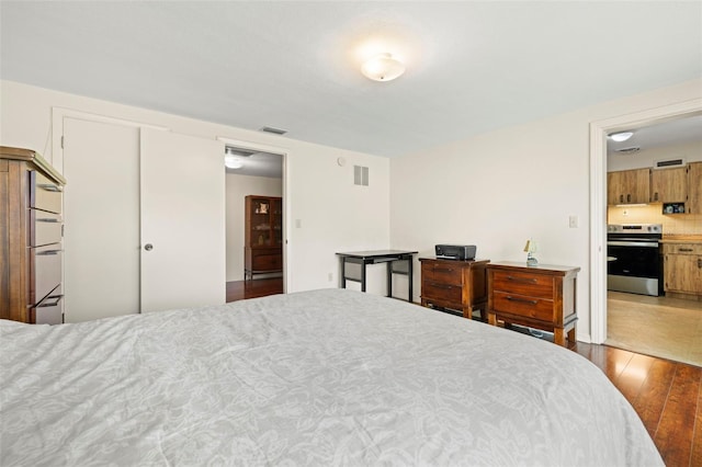 5800 3rd St S, Saint Petersburg, FL 33705 - bedroom featuring wood-type flooring