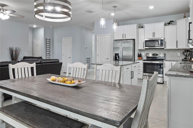 12653 Palapa Loop, Spring Hill, FL 34610 - dining room with recessed lighting, a ceiling fan, and light tile patterned floors