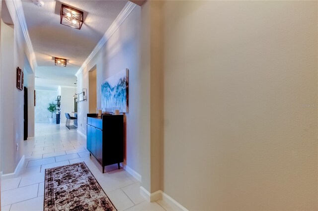 2456 Arbor Wind Dr, Lutz, FL 33558 - corridor with crown molding, light tile patterned floors, and baseboards